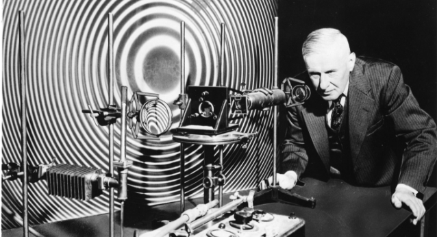 Old Photo of male looking through scientific device