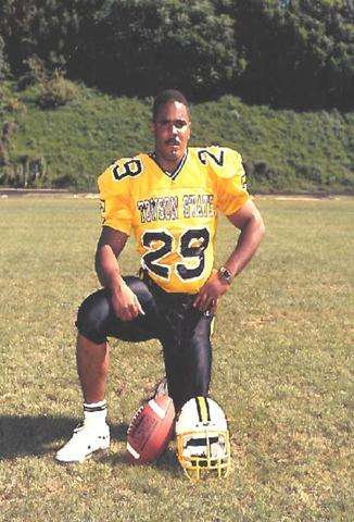 Dan Sawyer on his knees in a football uniform