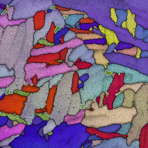 Microscope image shows multicolored jagged shapes