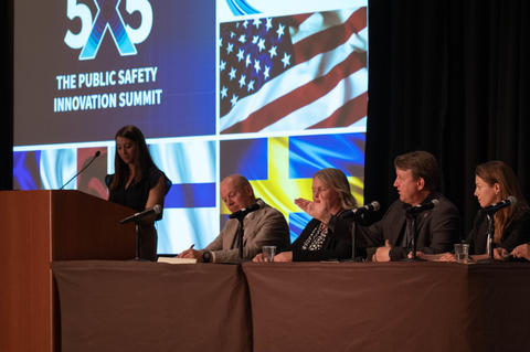 Jeff Bratcher of the FirstNet Authority addresses the crowd during the “Collaboration Among Nations” panel, which brought together representatives from the United States, Sweden, Finland, and France. Brianna Huettel, pictured left, moderated the panel.