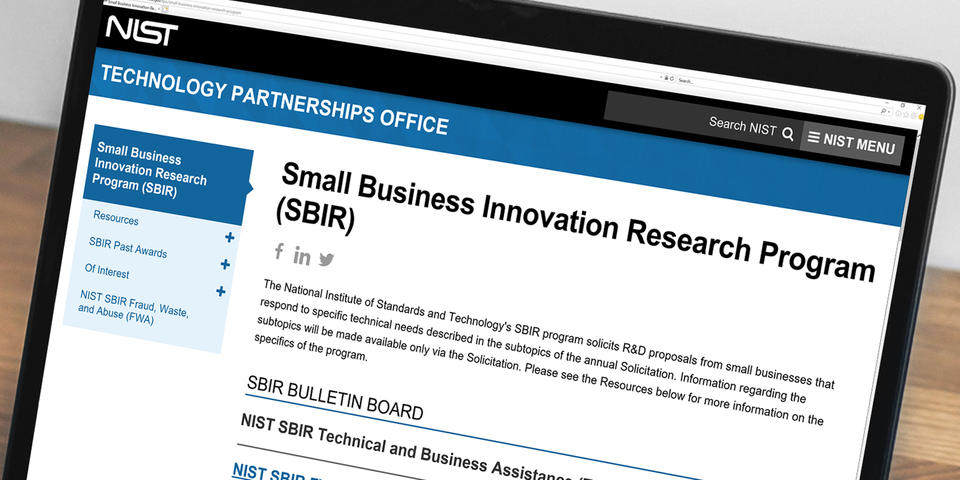 Image of a laptop displaying the SBIR website