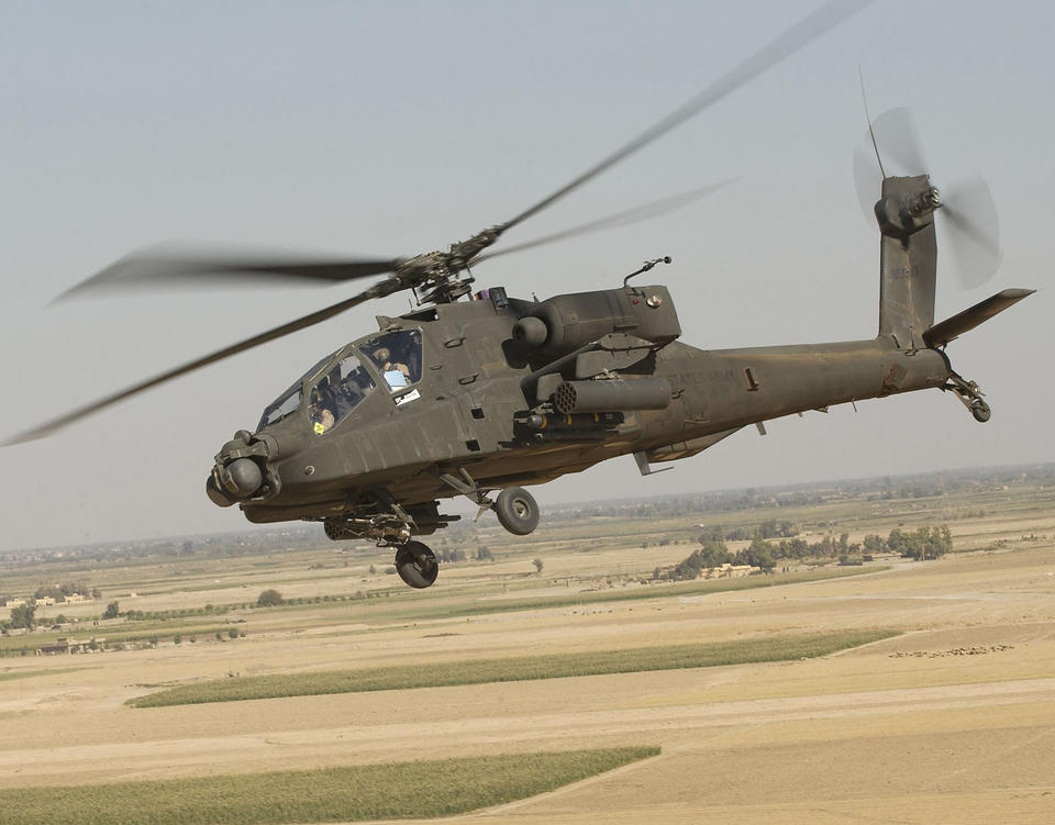 Apache helicopter flies near the ground