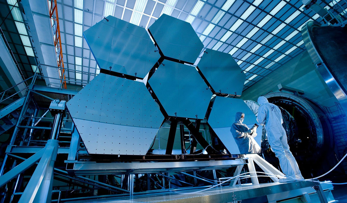 Image of a lab tech working on reflective panels