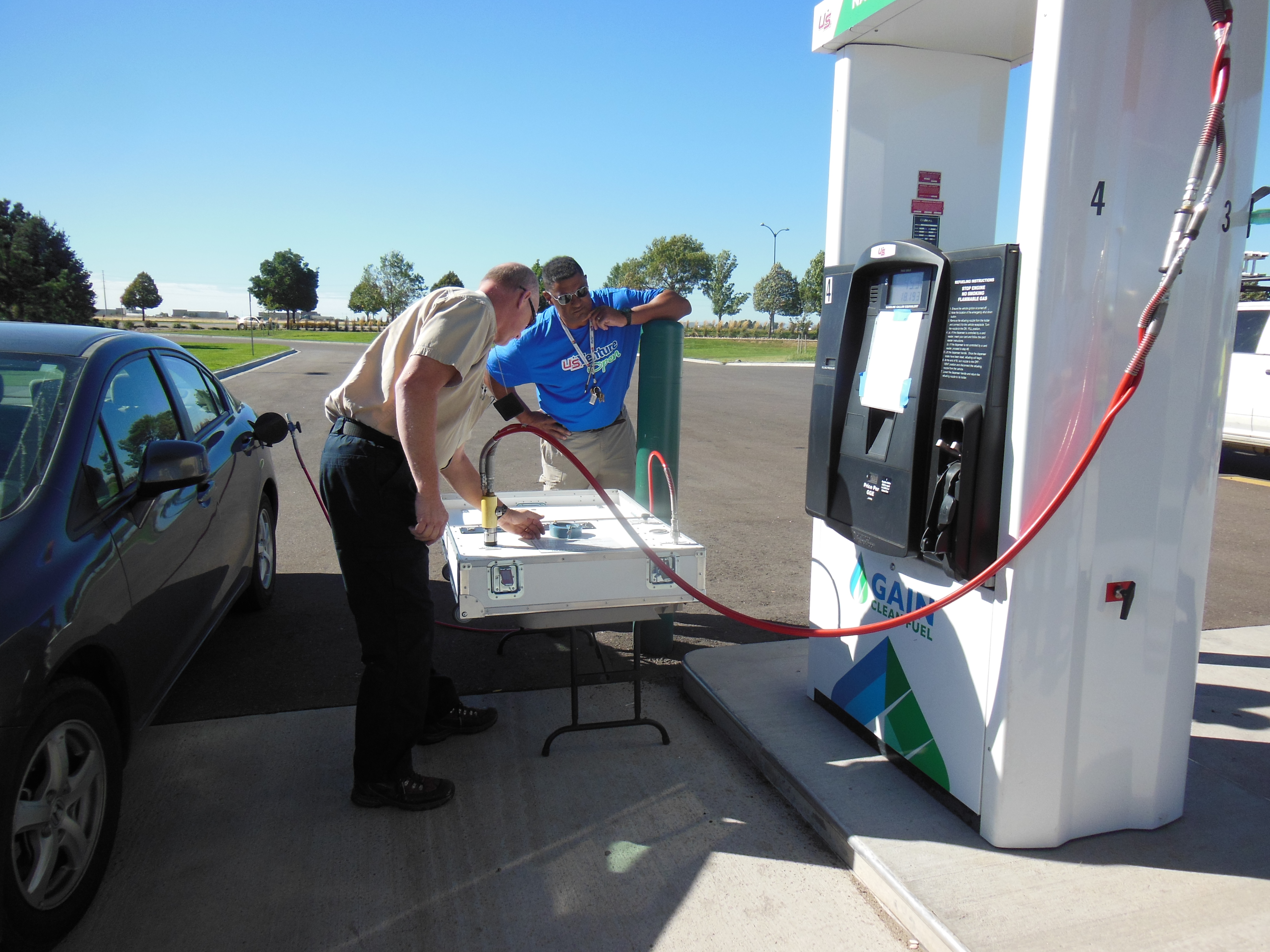 Colorado Division of Oil and Public Safety’s Scott Wagner checks a readout on a device meant to check the flow of natural gas automotive fuel