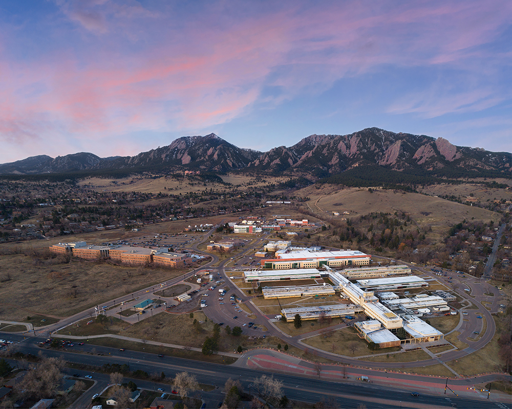 Early morning aerial view of NIST's Boulder, Colorado, campus, the Flatiron Mountains are in the background 