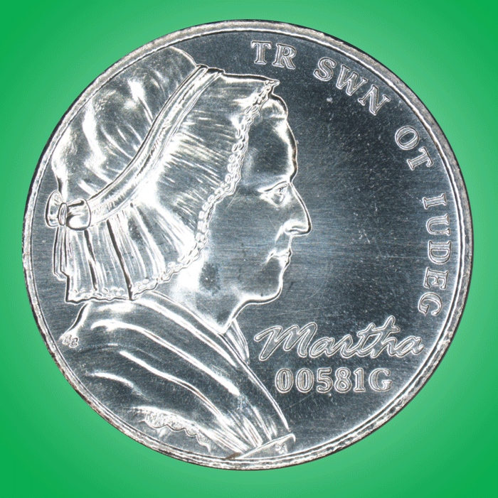 green background. Animated gif of the two sides of the new nickel. The new nickel is the same shape and size as a regular nickel, but instead of Thomas Jefferson has a profile of Martha Washington in a mob cap and dummy text instead of "E Pluribus Unum."