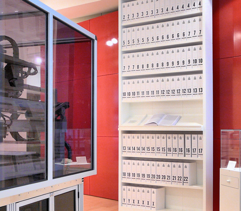 a bookcase of containing over 100 volumes