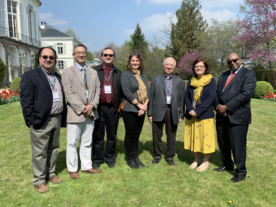 Group of people posing for a photo on a sunny day