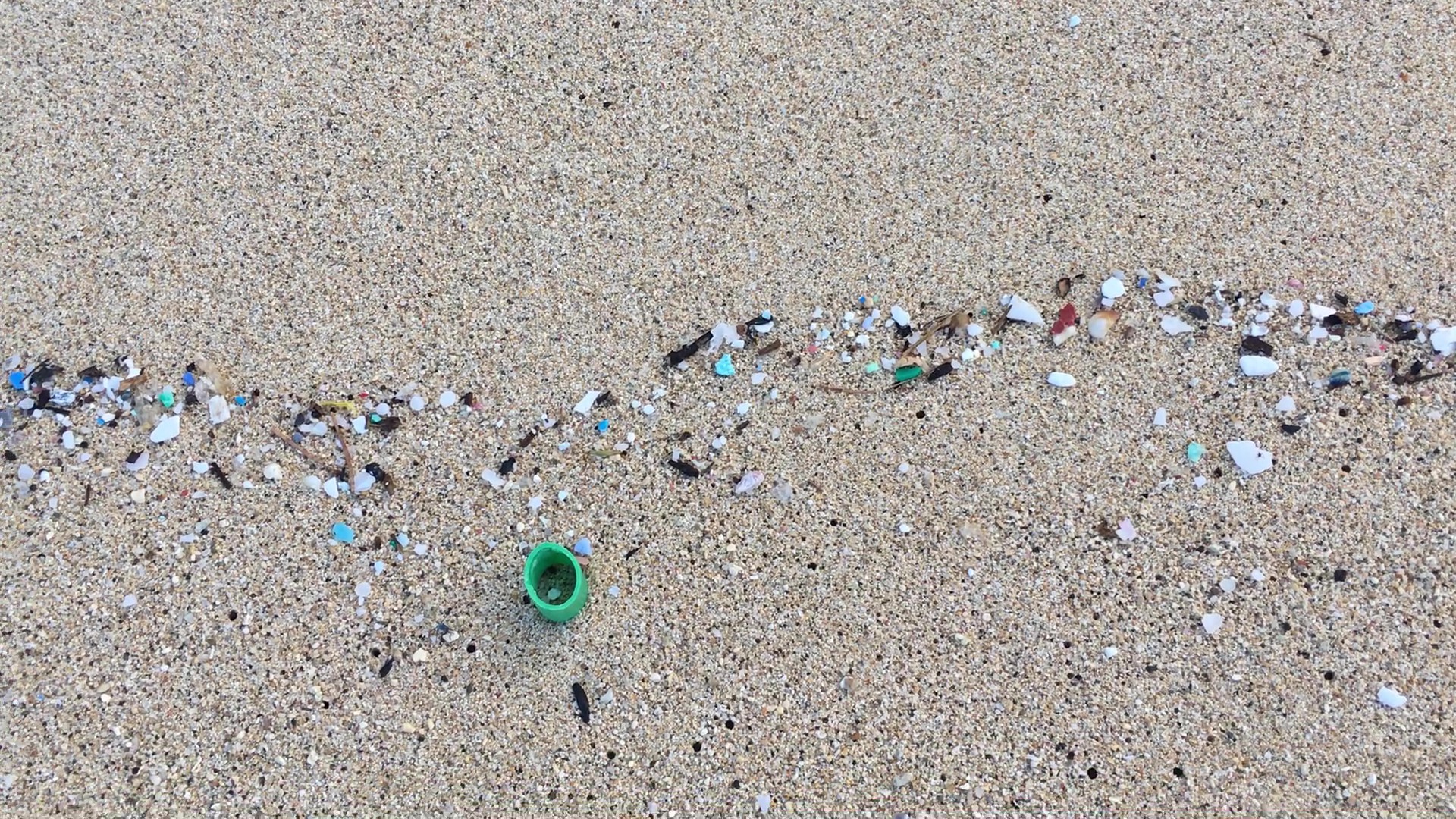 small pieces of plastic on a beach