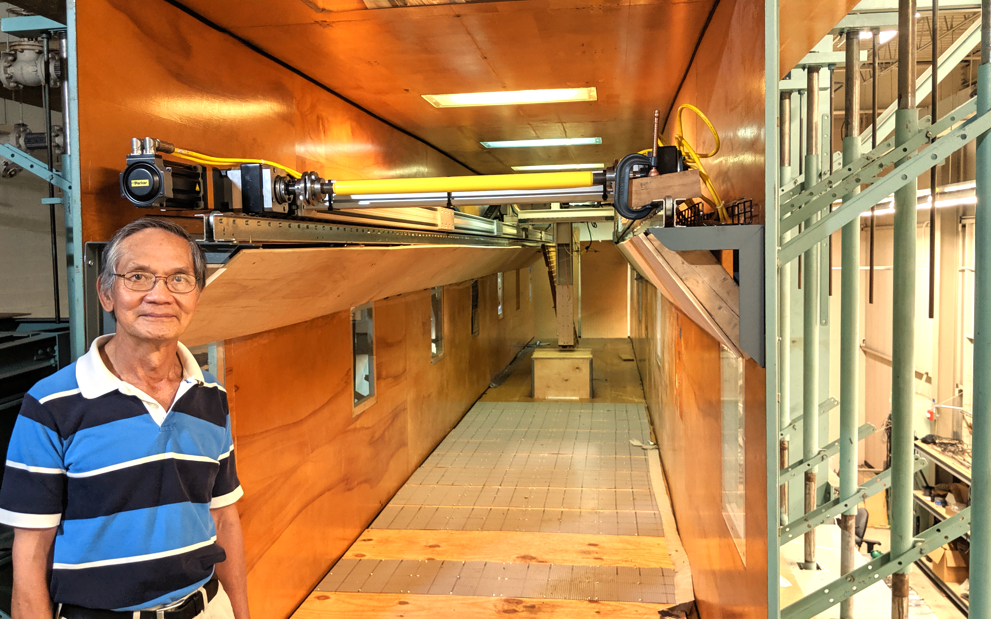 man in front of a long corridor