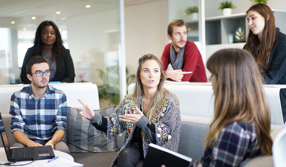 Image of a group of people discussing a topic