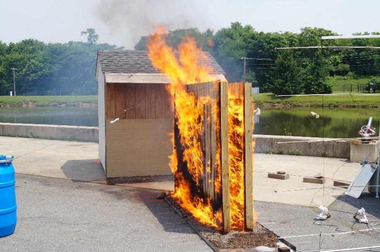 two parallel fence panels burning