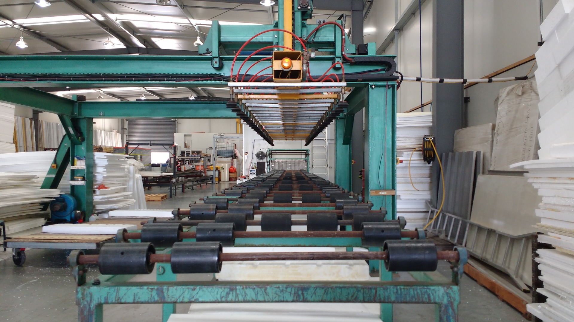 A photo of a manufacturing floor, possibly manufacturing construction materials.