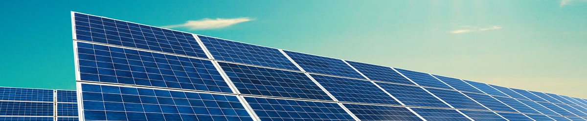 Upclose image of solar panels on blue sky