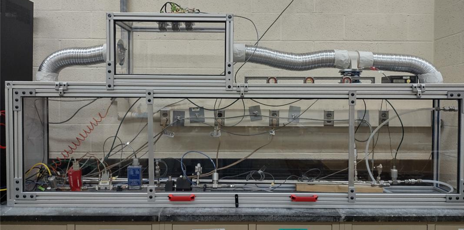 A prototype realization of Figure 1 with a collection volume that is 1/8th of the final volume to be used. The enclosure is temperature controlled at 25 °C.