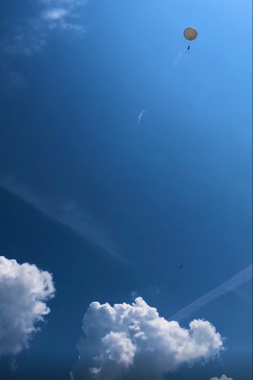 Radiosonde ascending into the sky after launch.