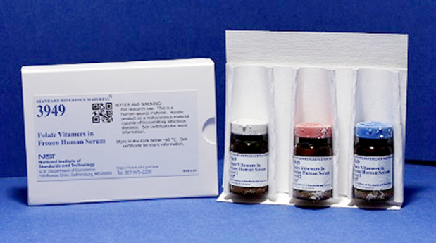 Photograph of SRM 3949 Folate Vitamers in Frozen Human Serum with labeled box and frozen capped bottles containing levels 1, 2, and 3. 