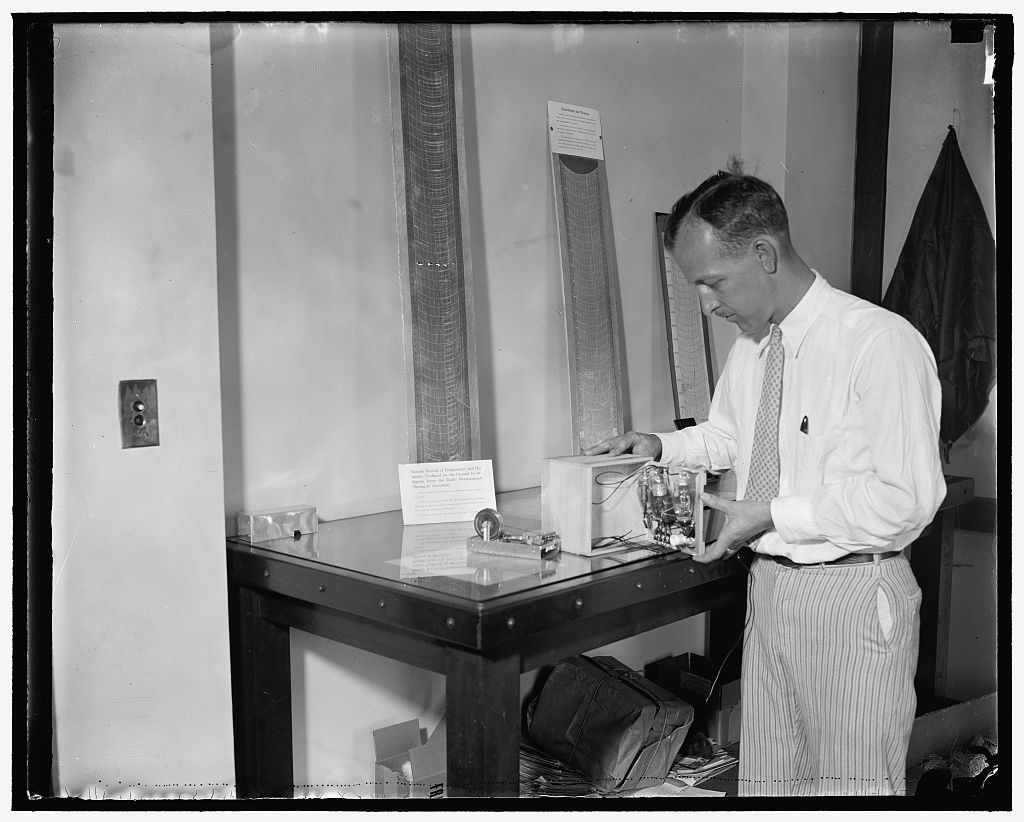Photograph of Evan G. Lapham with a laboratory version of the radiosonde developed by NBS for the Navy, 1937.