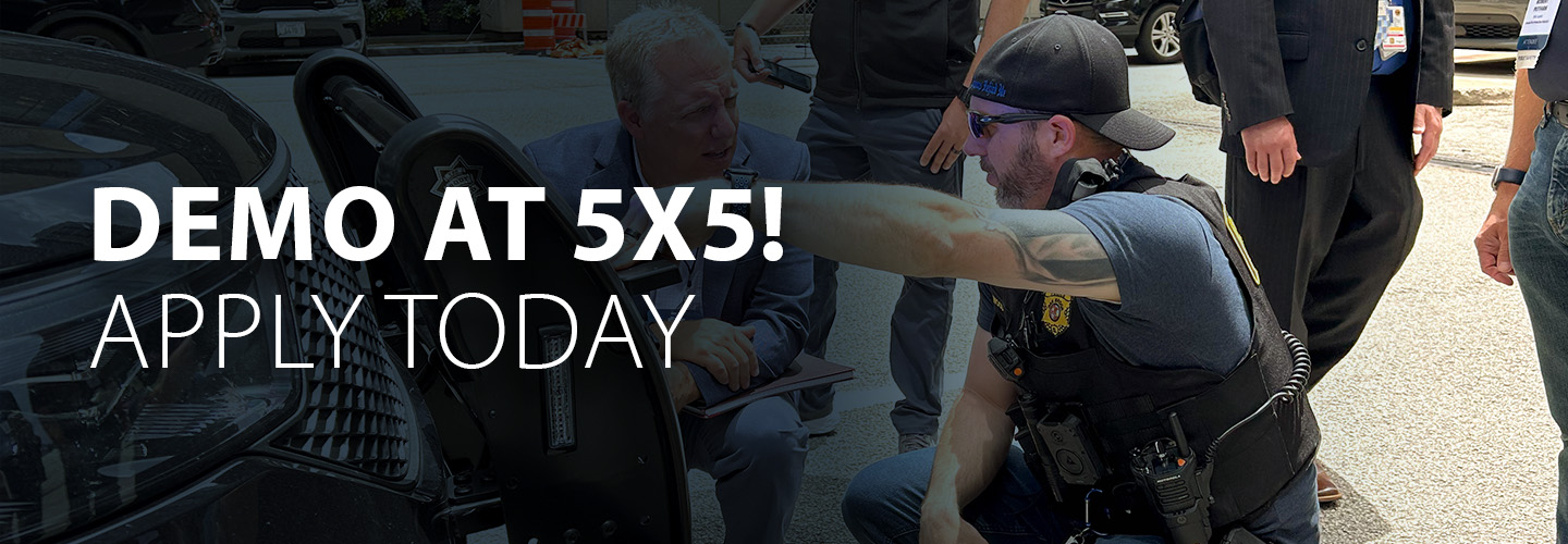 Two men participating in tech demo at 5x5 2024 in Chicago.
