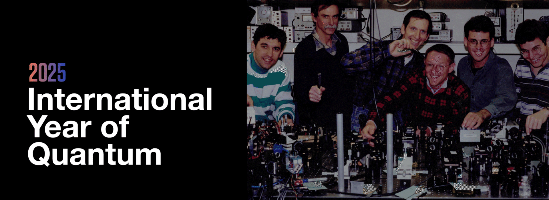 Banner says 2025 International Year of Quantum with photo of six researchers posing smiling in a lab.