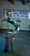 The RoboCrane TETRA placing a steel beam in a stanchion. 