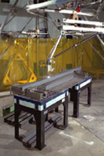 Side view of the RoboCrane platform welding a beam 