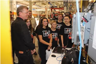 STEM students fascinated by manufacturing.