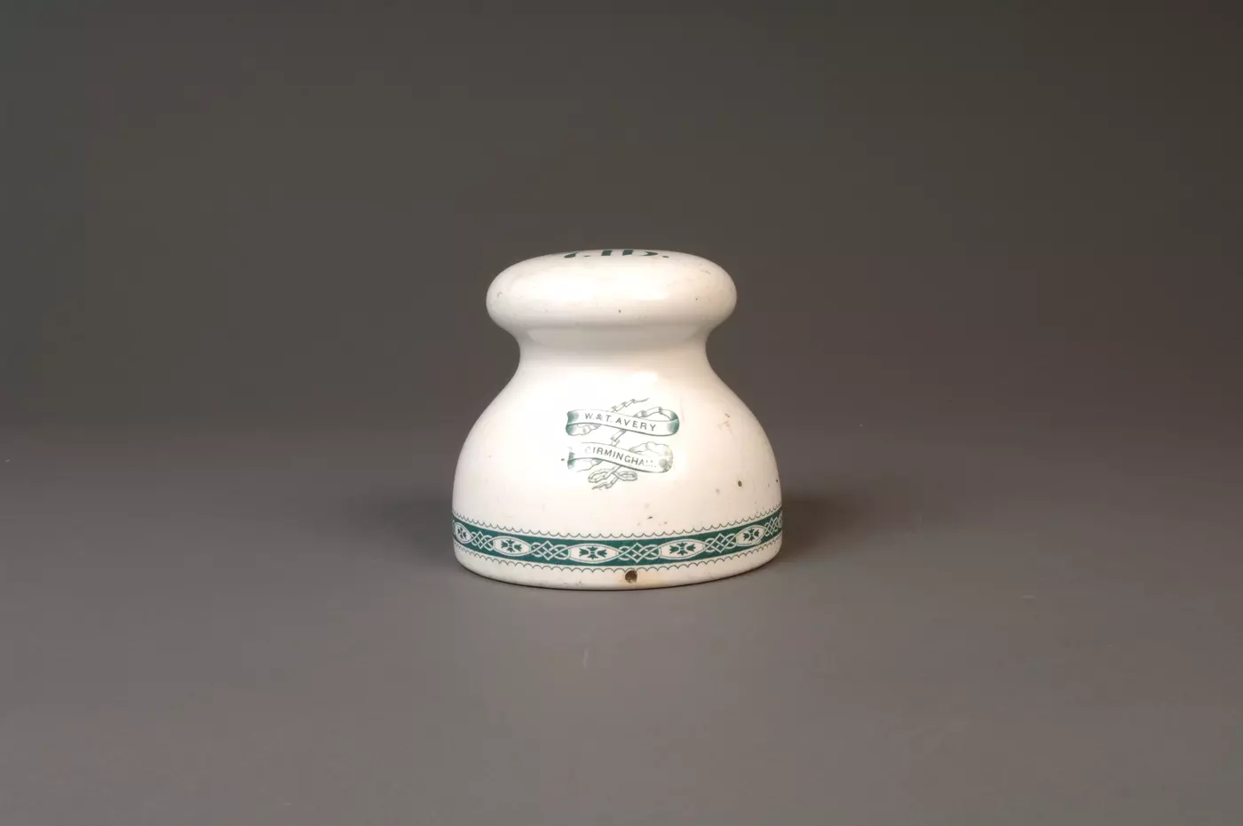 Front view of white and blue Earthenware Weight