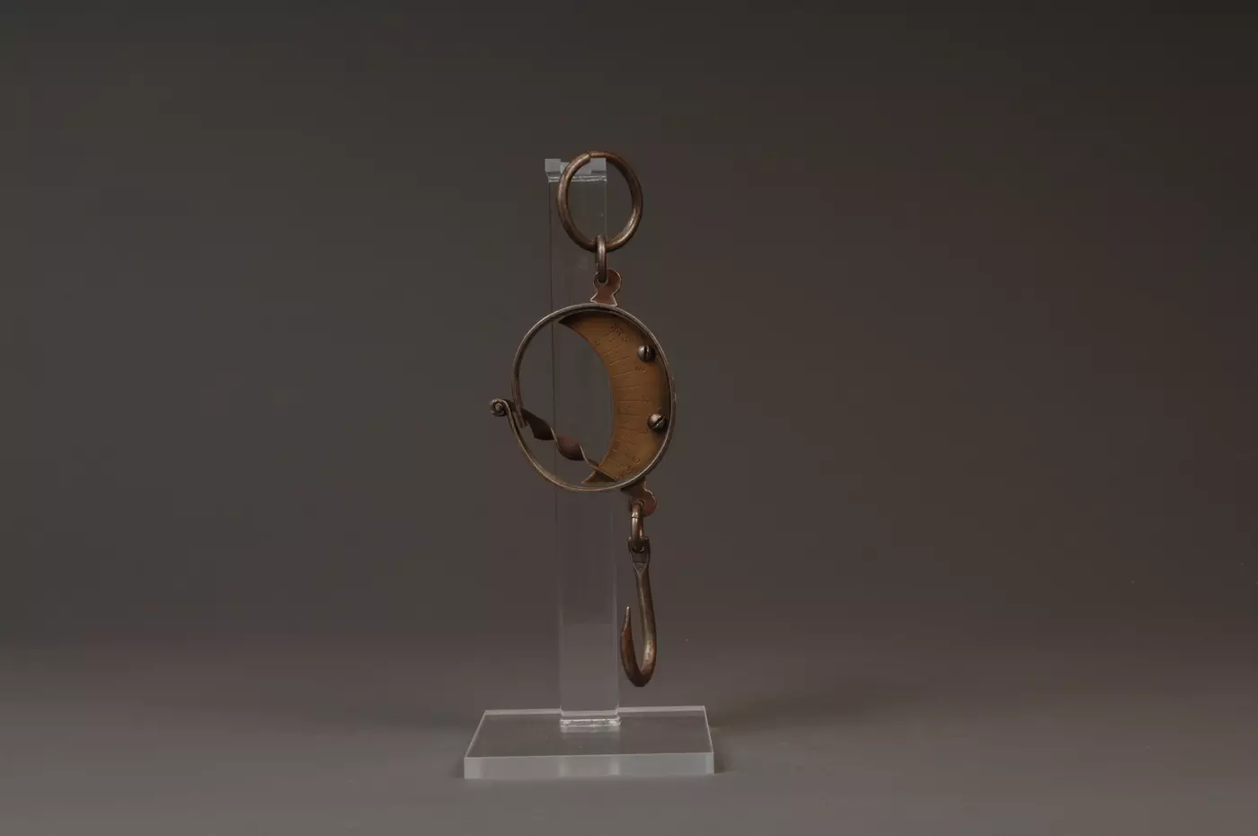 Steel mancur balance hanging on clear plastic stand