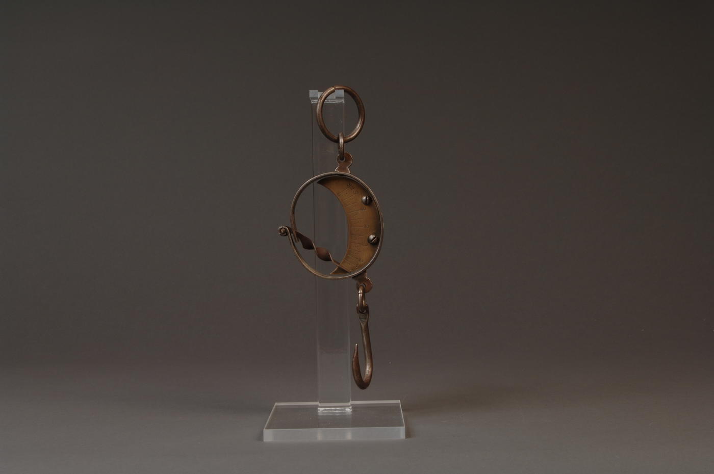 Steel mancur balance hanging on clear plastic stand