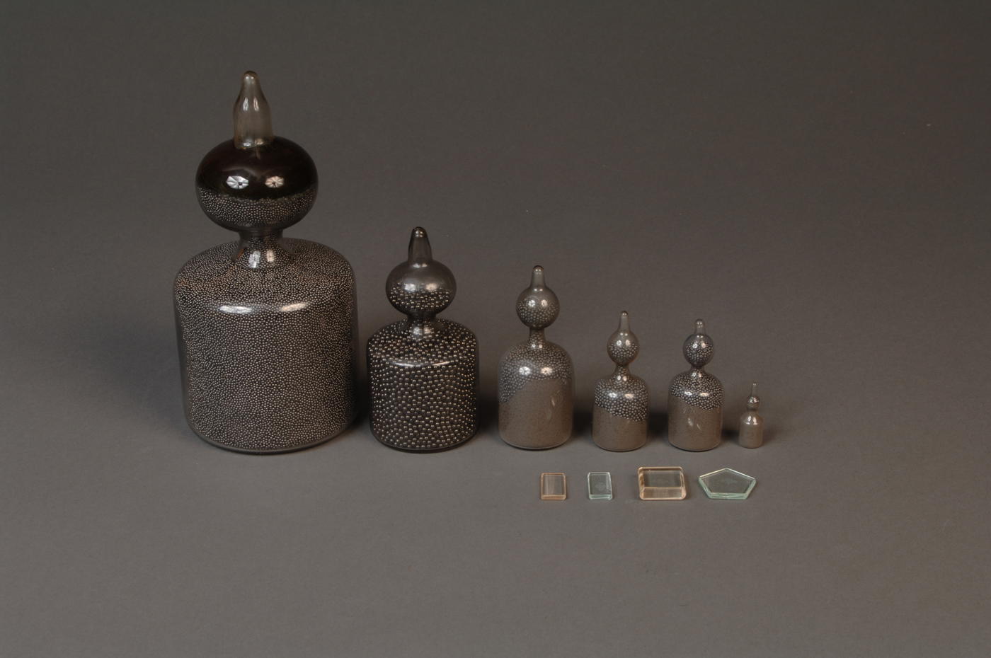 Set of 6 large weights filled with lead shot and 4 small weights made of glass