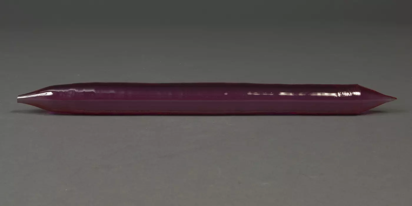A purple crystal cylinder, pointed at the ends