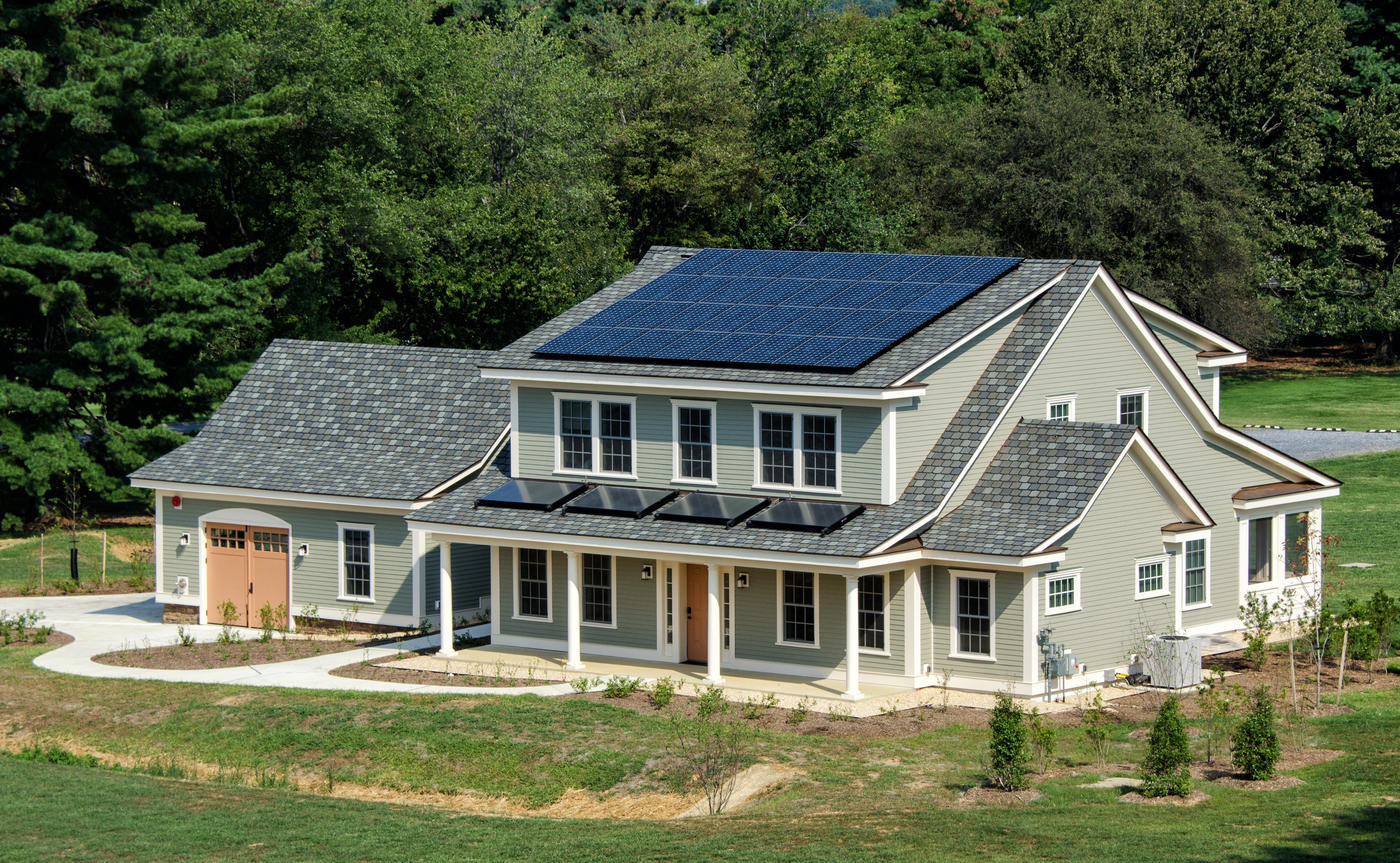 photo of a house. Solar panels on the roof.