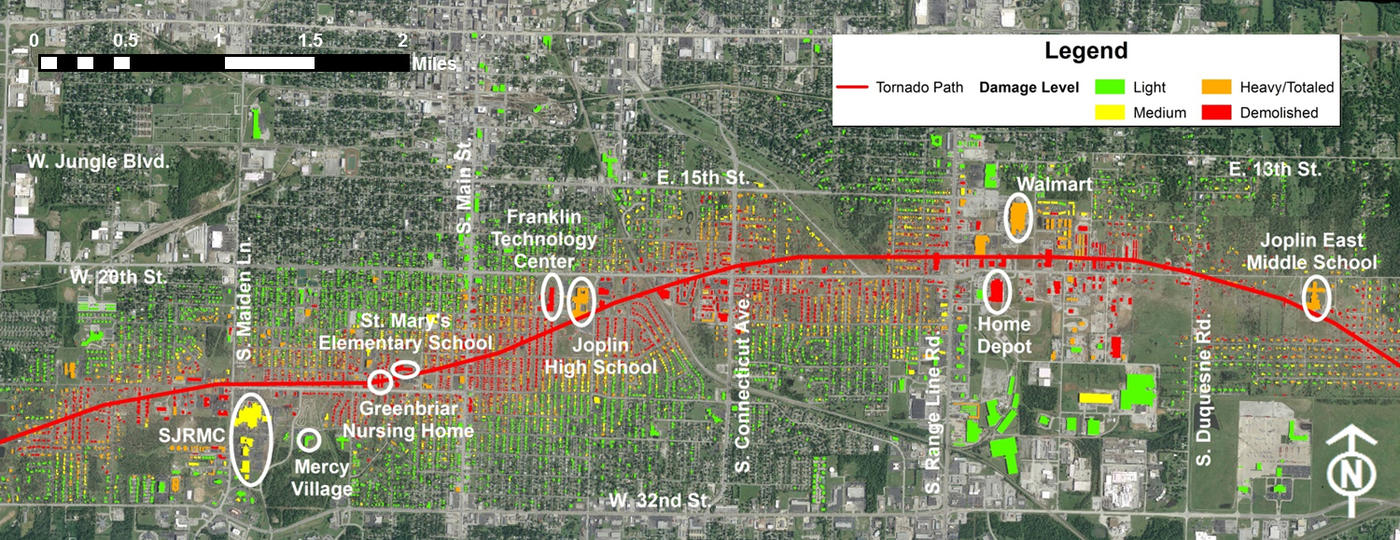Aerial image of Joplin, Mo, with lines of the tornado path and levels of damage.