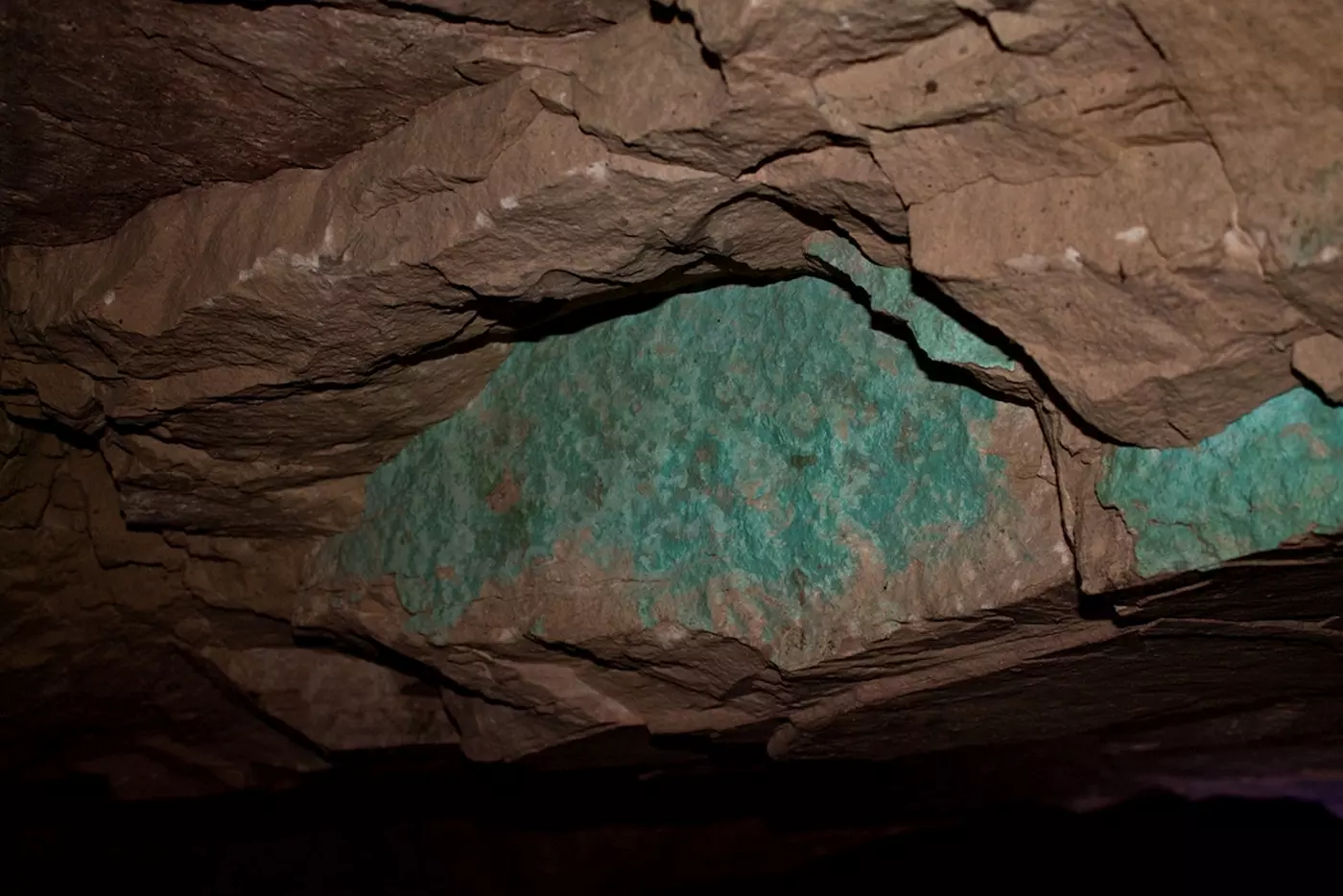 An image of the inside of a Wadi Faynan mine. The blue coloring shows a vein of copper.