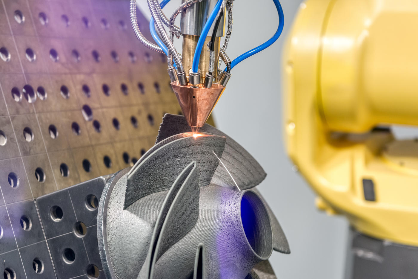 a 3D metal printer produces a complex steel part