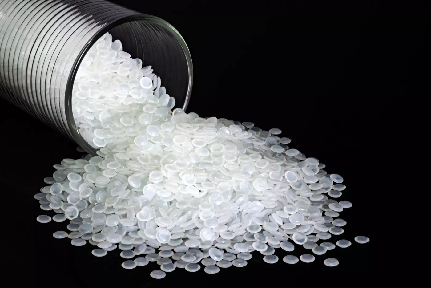 a vial of white polymer beads for industry/research
