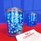 Illustration shows two clear jars full of marbles on a red table with a piece of paper that says “Find the Concentration.”