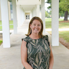 Erica Romsos poses outdoors on the NIST campus. 
