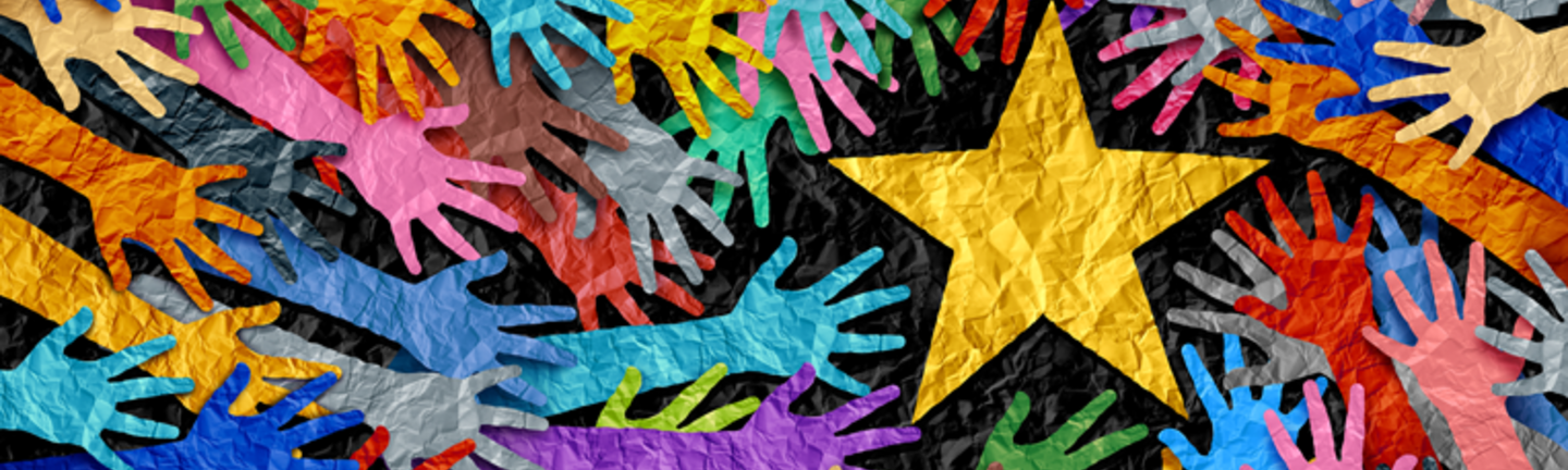 multi colored hands reaching towards a star for a success in business concept