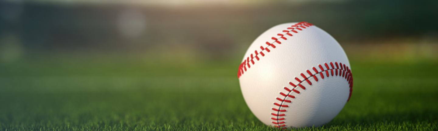 Baseball ball in a grass of baseball arena stadium