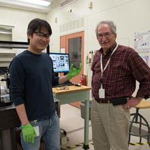 NIST researchers Nam Nguyen and Martin Green showing off their smart window test wafer. 
