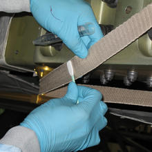 A technician swabs for microbes on a mockup of the interior of the International Space Station at NASA's Kennedy Space Center in Florida. 