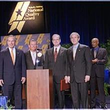 Pictured (Left to right): Commerce Secretary Don Evans; Pal Barger, chairman and founder, Pal's Sudden Service; Thomas Crosby, president and CEO, Pal's Sudden Service; President Bush.