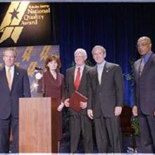 Pictured (Left to right): Commerce Secretary Don Evans; Julie Furst-Bowe, associate vice chancellor, University of Wisconsin-Stout; Charles Sorensen, chancellor, University of Wisconsin-Stout; President Bush; Education Secretary Rod Paige.