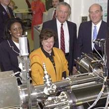 Officials are briefed about new nanotechnology research at the National Institute of Standards and Technology after the ceremonial groundbreaking for the Advanced Measurement Laboratory.