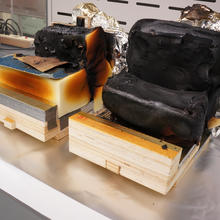 Residues of an identical foam-fabric assembly in the current (left) and in the modified (right) smoldering ignition setup (45 min test duration)