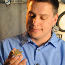 NIST research affiliate John Teufel holding his micro drum