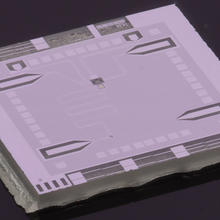 Photo of the NIST optics table on a chip