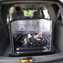 Photo of an advanced laser in the back of a car